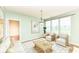 Cozy living room with ample natural light, a stylish rug, comfortable seating and an elegant pendant light at 15946 Marsala Dr, Fishers, IN 46037
