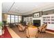 Community living room with comfortable seating, a fireplace, and bookshelves at 15946 Marsala Dr, Fishers, IN 46037