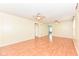 Large living room featuring wood-look flooring, light neutral walls and view to other rooms at 15946 Marsala Dr, Fishers, IN 46037