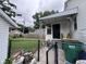 The home's fenced back porch area with a view of the backyard and neighboring houses at 1768 N Lynhurst Dr, Speedway, IN 46224