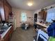 A view of the kitchen area that features a breakfast table and pantry area at 1768 N Lynhurst Dr, Speedway, IN 46224