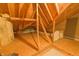 Attic's exposed beams offer a glimpse into potential renovations and customizations at 1870 Broadleaf Ct # 10, Greenwood, IN 46143
