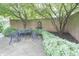 Charming backyard patio with a peaceful fountain and landscaped garden at 1870 Broadleaf Ct # 10, Greenwood, IN 46143