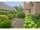 Backyard patio with lush greenery, offering a serene and private outdoor retreat at 1870 Broadleaf Ct # 10, Greenwood, IN 46143