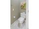 Compact powder room featuring a standard toilet, and a modern tile floor at 1870 Broadleaf Ct # 10, Greenwood, IN 46143