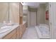 Elegant bathroom with a large soaking tub, double sink vanity, and tile flooring at 1870 Broadleaf Ct # 10, Greenwood, IN 46143