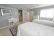 Cozy bedroom with blue walls, complemented by a writing desk and white dressers at 1870 Broadleaf Ct # 10, Greenwood, IN 46143