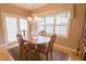 Traditional dining room with a wood table, chandelier, and window offering natural light at 1870 Broadleaf Ct # 10, Greenwood, IN 46143