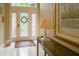 Welcoming foyer featuring a marble floor, decorative rug, console table, and a view of the glass-paned front door at 1870 Broadleaf Ct # 10, Greenwood, IN 46143
