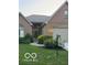 Charming brick home featuring a well-manicured lawn and inviting front entrance, perfect for a Gathering at 1870 Broadleaf Ct # 10, Greenwood, IN 46143