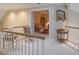 Cozy hallway leading to a sitting room featuring a rocking chair and wood furnishings at 1870 Broadleaf Ct # 10, Greenwood, IN 46143