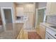 View of the kitchen with light wood cabinetry and stainless steel refrigerator at 1870 Broadleaf Ct # 10, Greenwood, IN 46143
