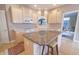 Bright kitchen with island, white appliances, and eat in breakfast area at 1870 Broadleaf Ct # 10, Greenwood, IN 46143