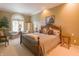 Tranquil main bedroom with a cozy seating area and large shuttered windows at 1870 Broadleaf Ct # 10, Greenwood, IN 46143