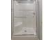 Bright bathroom shower with a sliding glass door and built in seat at 1870 Broadleaf Ct # 10, Greenwood, IN 46143
