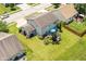 Aerial view of the home with large backyard with an outdoor entertainment area and hot tub at 2020 Treving Dr, Cicero, IN 46034