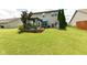 Expansive backyard with a pergola, built-in grill, lush green grass, and room for outdoor enjoyment at 2020 Treving Dr, Cicero, IN 46034