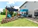 Outdoor living with cozy seating, a relaxing pergola, and lush landscaping in a private backyard at 2020 Treving Dr, Cicero, IN 46034