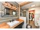 Stylish bathroom featuring wood accents, glass shower, and a walk in closet at 2020 Treving Dr, Cicero, IN 46034