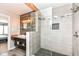 Modern bathroom with wood wall accent, wood shelving, and glass shower at 2020 Treving Dr, Cicero, IN 46034