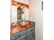 Unique powder room featuring a wooden countertop and decorative light fixture at 2020 Treving Dr, Cicero, IN 46034