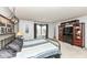 A bedroom with decorative headboard, a corner window, and wood furnishings at 2020 Treving Dr, Cicero, IN 46034