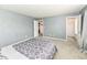 Carpeted bedroom with open doors showing closet and other rooms at 2020 Treving Dr, Cicero, IN 46034
