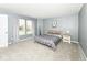 Carpeted bedroom with 2 large windows and a light wood bed frame at 2020 Treving Dr, Cicero, IN 46034