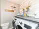 Laundry room with modern washer and dryer and laundry decorations at 2020 Treving Dr, Cicero, IN 46034
