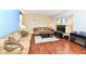 Inviting living room featuring hardwood floors, warm lighting, and comfortable seating at 2020 Treving Dr, Cicero, IN 46034