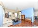 Cozy living room with hardwood floors, blue accent wall, and comfortable seating at 2020 Treving Dr, Cicero, IN 46034