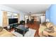 Open-concept living room with hardwood floors connecting to the dining and kitchen areas at 2020 Treving Dr, Cicero, IN 46034