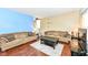 Comfortable living room with hardwood floors and a cozy seating area bathed in natural light at 2020 Treving Dr, Cicero, IN 46034
