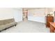 Spacious loft features neutral carpet and a comfortable futon at 2020 Treving Dr, Cicero, IN 46034