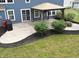 Landscaped backyard with a patio, fire pit, and well-maintained lawn at 21491 Raccoon Ct, Noblesville, IN 46062