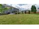 Enjoy the expansive backyard with a covered patio, fire pit, and large grassy area at 21491 Raccoon Ct, Noblesville, IN 46062