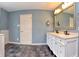 Bathroom featuring a double vanity, ample counter space and natural lighting at 21491 Raccoon Ct, Noblesville, IN 46062