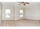 Bright and airy bedroom with neutral walls, carpeted floor, ceiling fan, and natural light from windows at 21491 Raccoon Ct, Noblesville, IN 46062