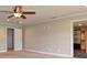 Bonus room showing neutral paint, carpet, ceiling fan and a nearby doorway at 21491 Raccoon Ct, Noblesville, IN 46062