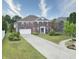 Beautiful brick two-story home with a manicured lawn, long driveway, and attached two-car garage at 21491 Raccoon Ct, Noblesville, IN 46062