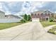 Beautiful brick two-story home with a manicured lawn and long driveway, perfect for Gathering gatherings at 21491 Raccoon Ct, Noblesville, IN 46062