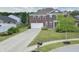 Charming brick two-story home with a long driveway, lush lawn, and plenty of curb appeal at 21491 Raccoon Ct, Noblesville, IN 46062