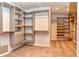 Spacious walk-in closet with custom shelving and ample storage space, perfect for organization at 21491 Raccoon Ct, Noblesville, IN 46062