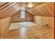 Finished attic space with wood paneled walls, hardwood floors, and natural light at 241 Wehmeier St, Columbus, IN 47201