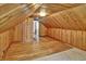 Finished attic space with wood paneled walls, hardwood floors, and natural light at 241 Wehmeier St, Columbus, IN 47201