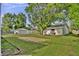 Secluded backyard offers a serene escape with lush greenery and ample space for recreation or gardening at 241 Wehmeier St, Columbus, IN 47201
