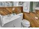 Cozy bathroom with wooden paneling, modern fixtures, and ample storage, a perfect blend of style and function at 241 Wehmeier St, Columbus, IN 47201