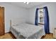 Comfortable bedroom with hardwood floors, large window, and ample space, offering a relaxing environment at 241 Wehmeier St, Columbus, IN 47201