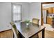 Inviting dining area featuring hardwood floors, natural light, and seating for four, perfect for cozy meals at 241 Wehmeier St, Columbus, IN 47201