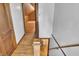 Hallway features hardwood floors, wood trim, and staircase to the upper level at 241 Wehmeier St, Columbus, IN 47201